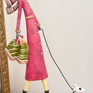 Whimsical Pink Figurine with Dog